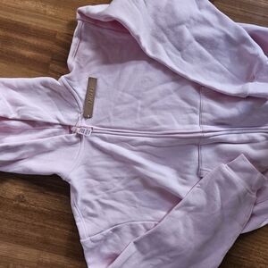 SKIMS Light Pink Zip-Up Hoodie